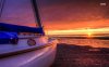 sailing-boat-on-a-sunset-beach-35188-1280x800.jpg