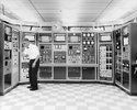 computer-nerd-scientist-working-vintage-mainframe-computers-retro-technology-man-wearing-bow-t...jpg