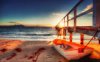 little_row_boat_tied_to_sea_pier_at_sunrise_hdr.jpg