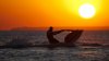 jet-skiing-at-sunset-photography-hd-wallpaper-1920x1080-16958.jpeg