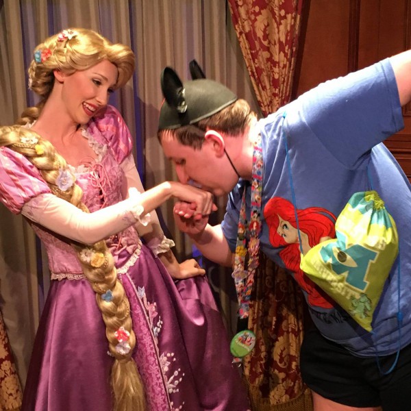 Kissing Rapunzel's hand