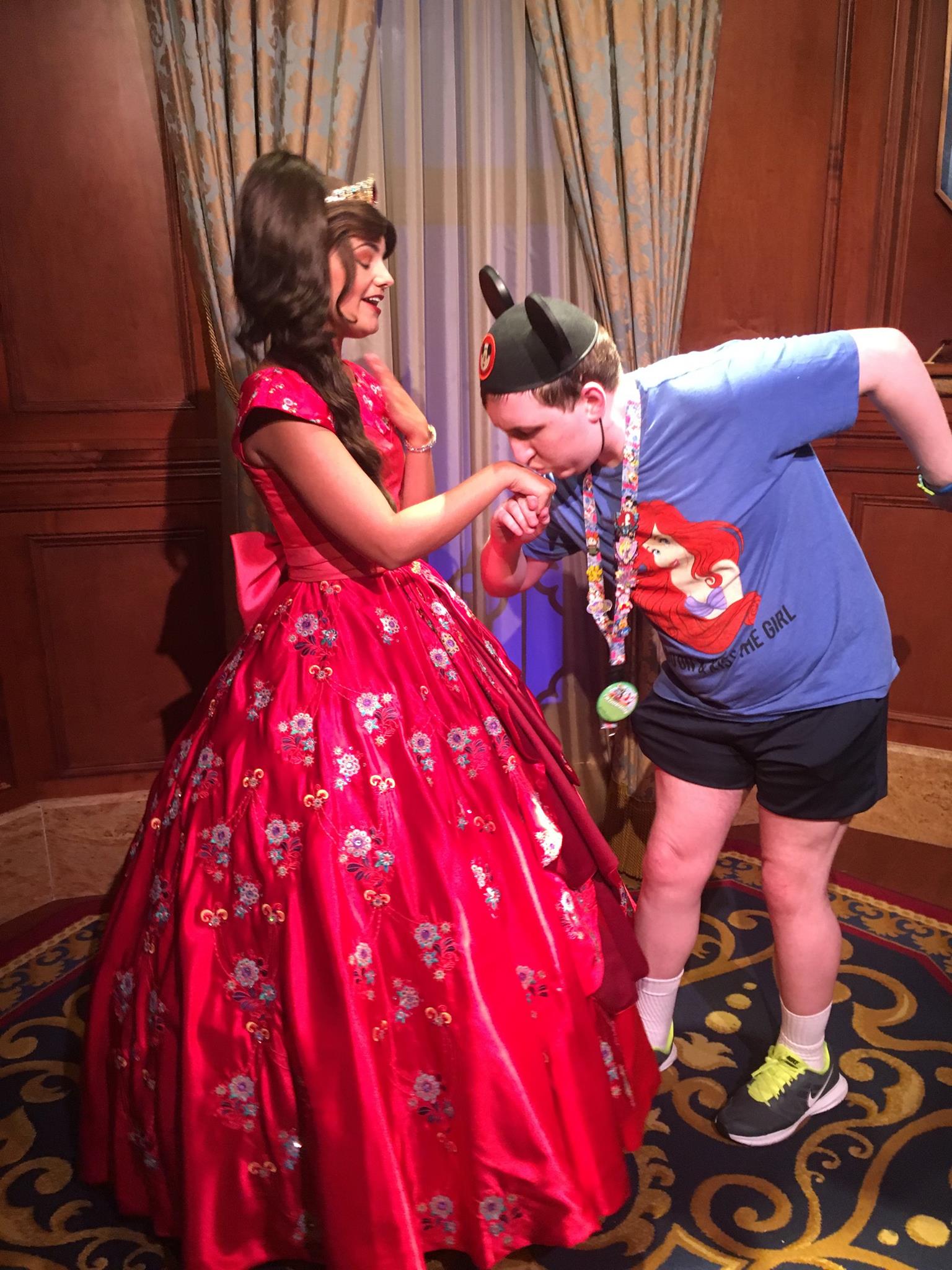 Kissing Elena's hand