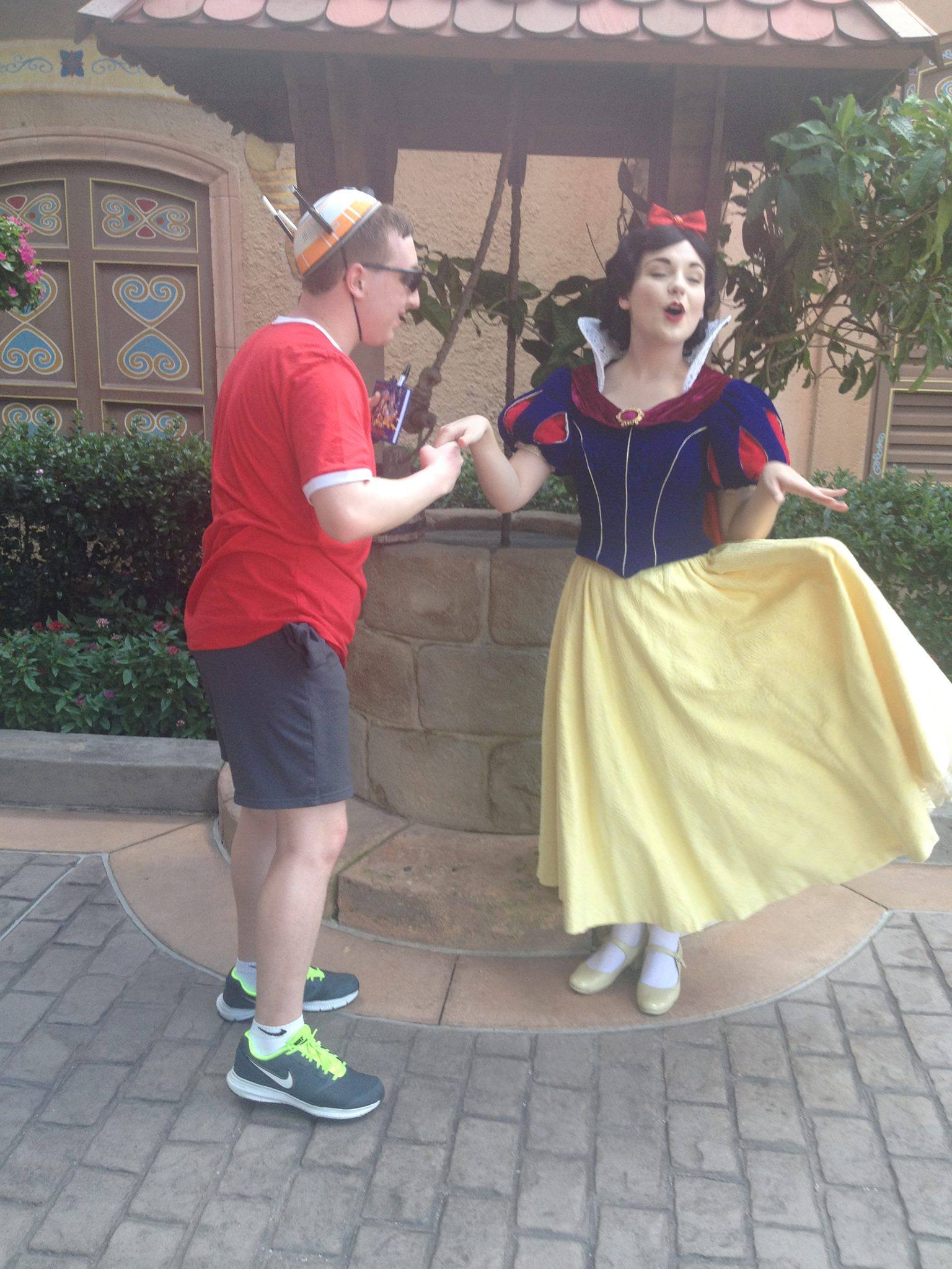Kissing Snow White's hand