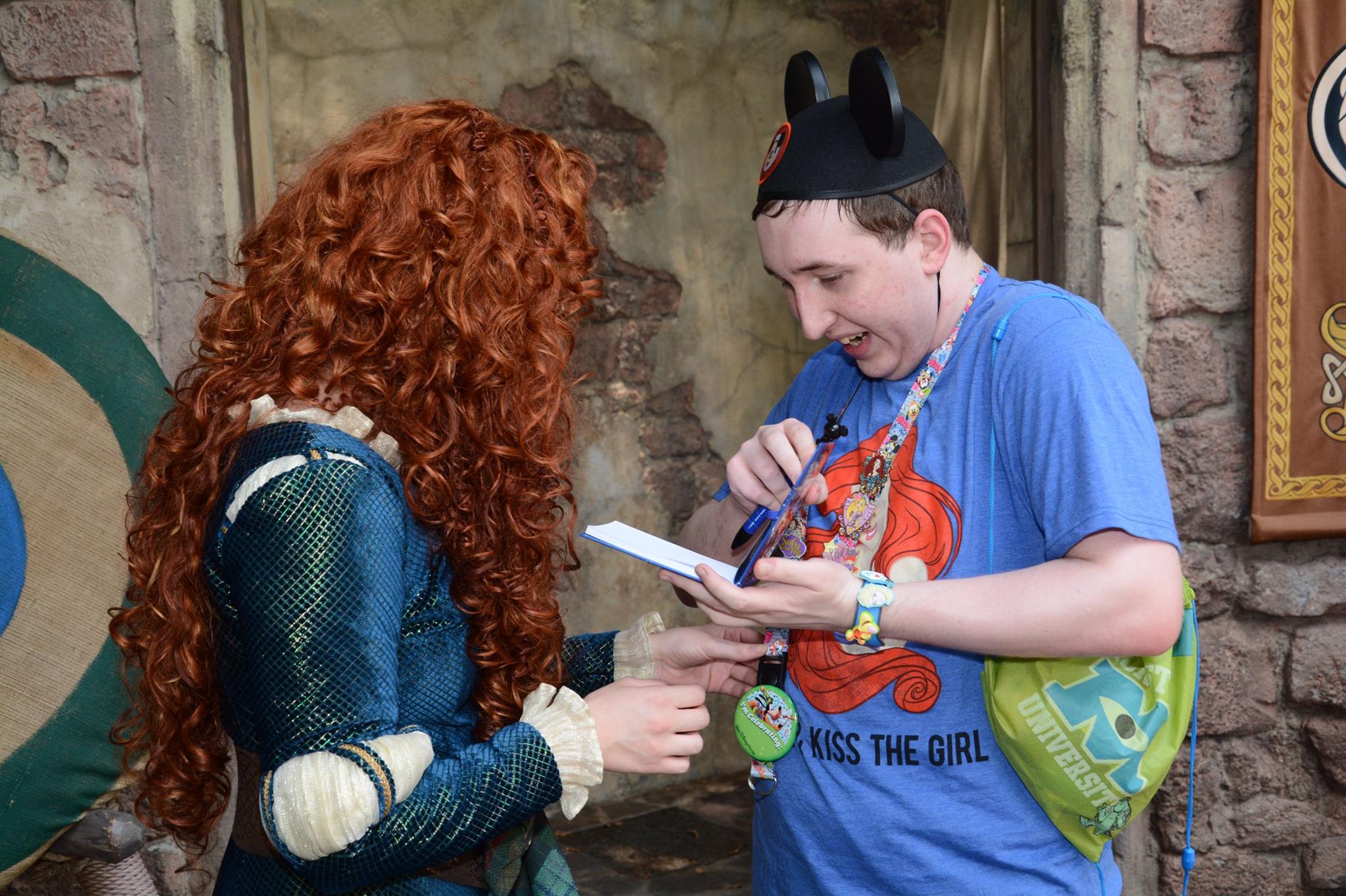 Showing Merida some of my Disney pins